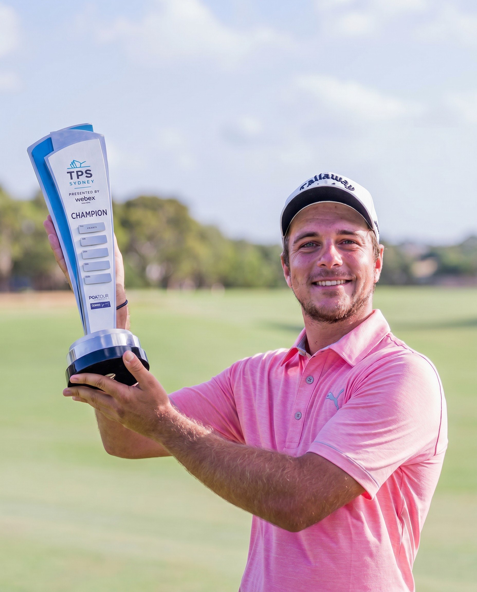 A player holding a championship trophy